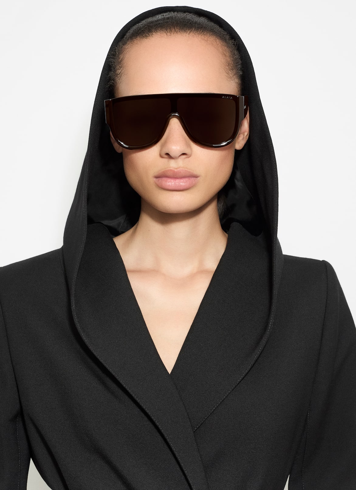 TAILORED WOOL COAT WITH HOOD  ALAÏA BLACK TAILORED WOOL COAT WITH HOOD